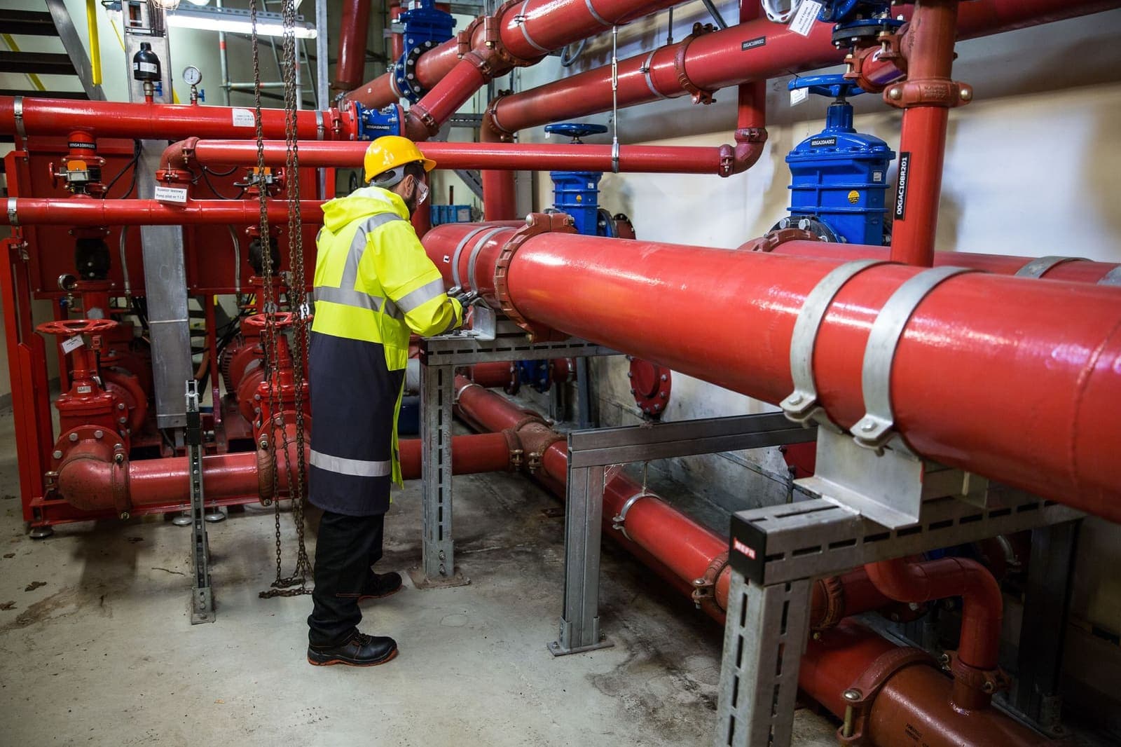 Facilities management engineer inspecting building systems