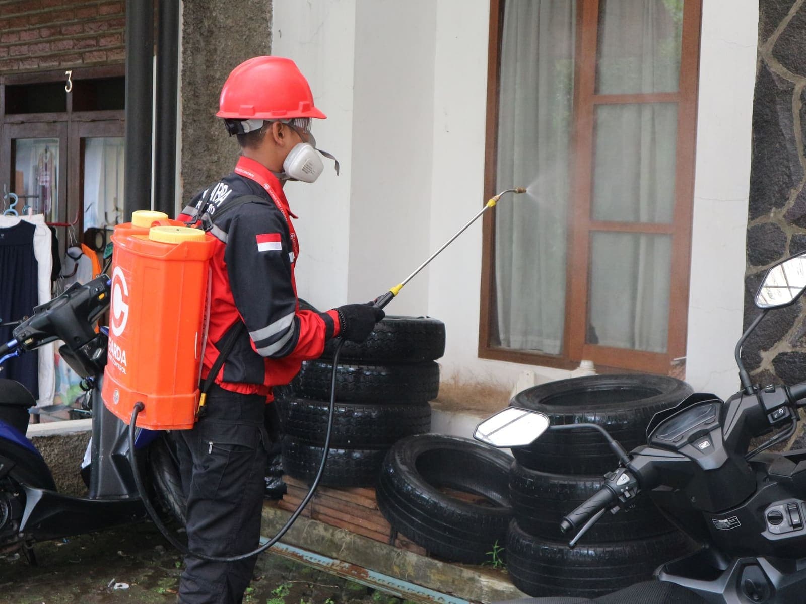 Pest control technician treating a property