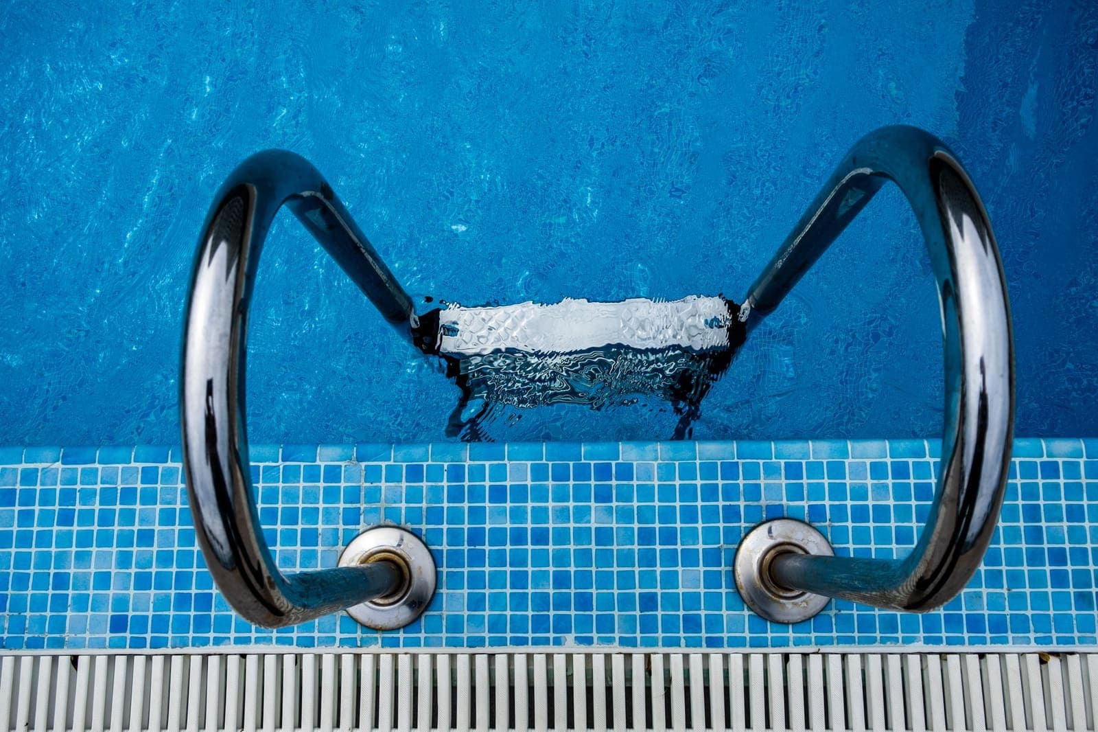 Clean, well-maintained swimming pool serviced under a pool maintenance contract